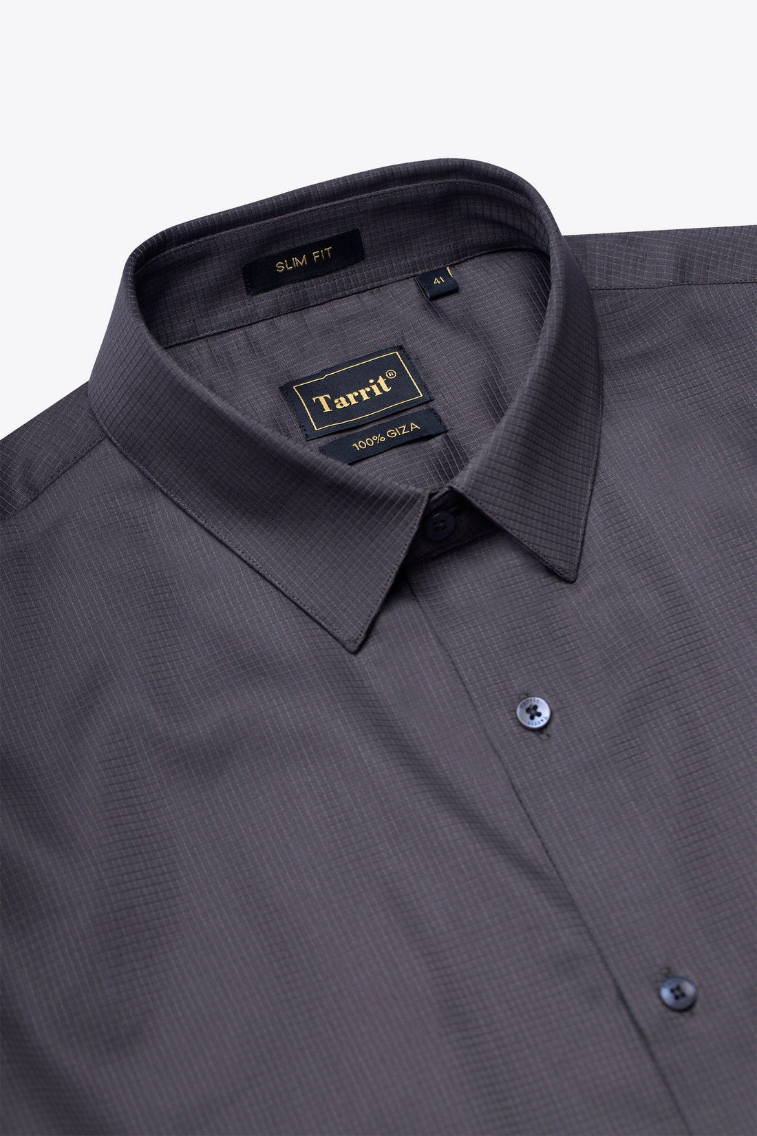 A made to measure Tarrit shirt on a shaped hanger, cared for to keep its tailored fit and crisp collar