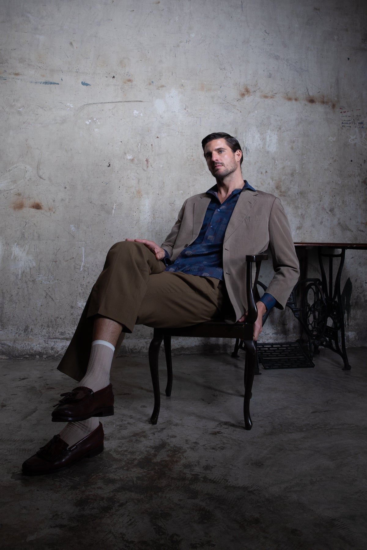 Premium ivory wedding shirt for men styled with beige tailored trousers and a blazer for an Indian wedding celebration.