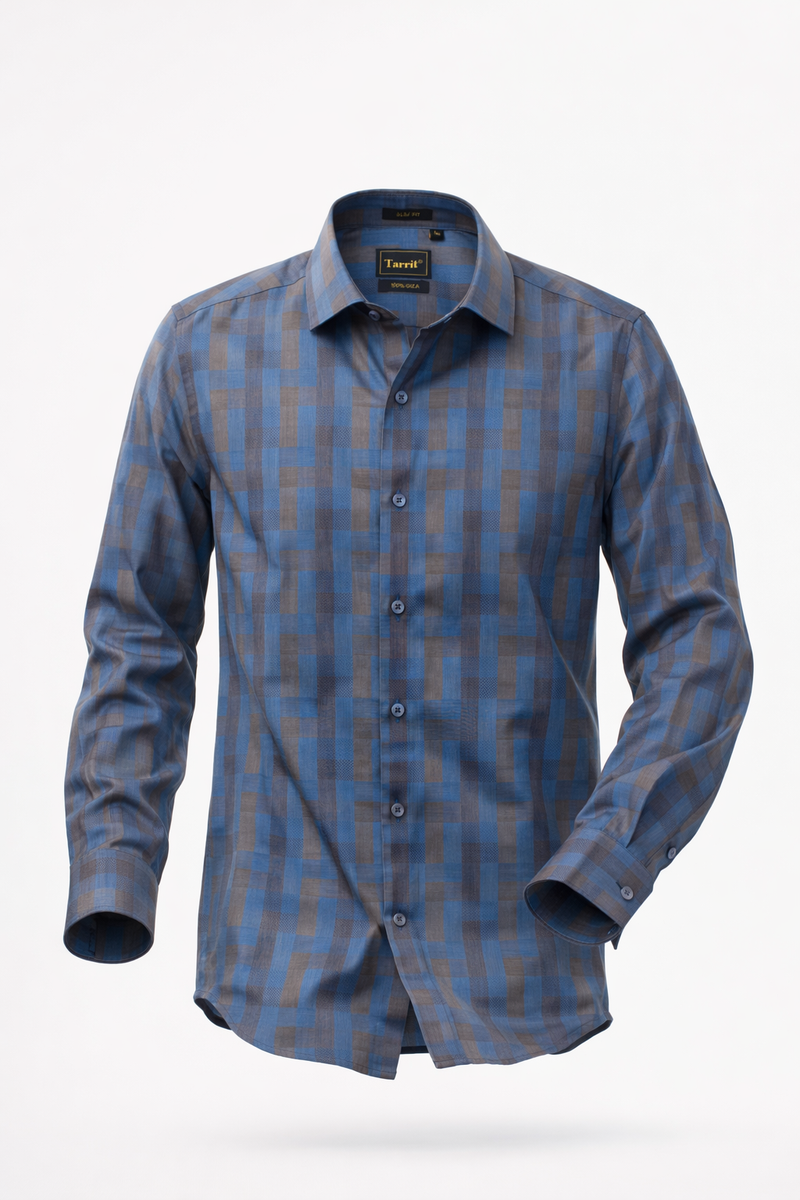 Man wearing a deep blue geometric print shirt tucked into black tailored trousers for a formal office look