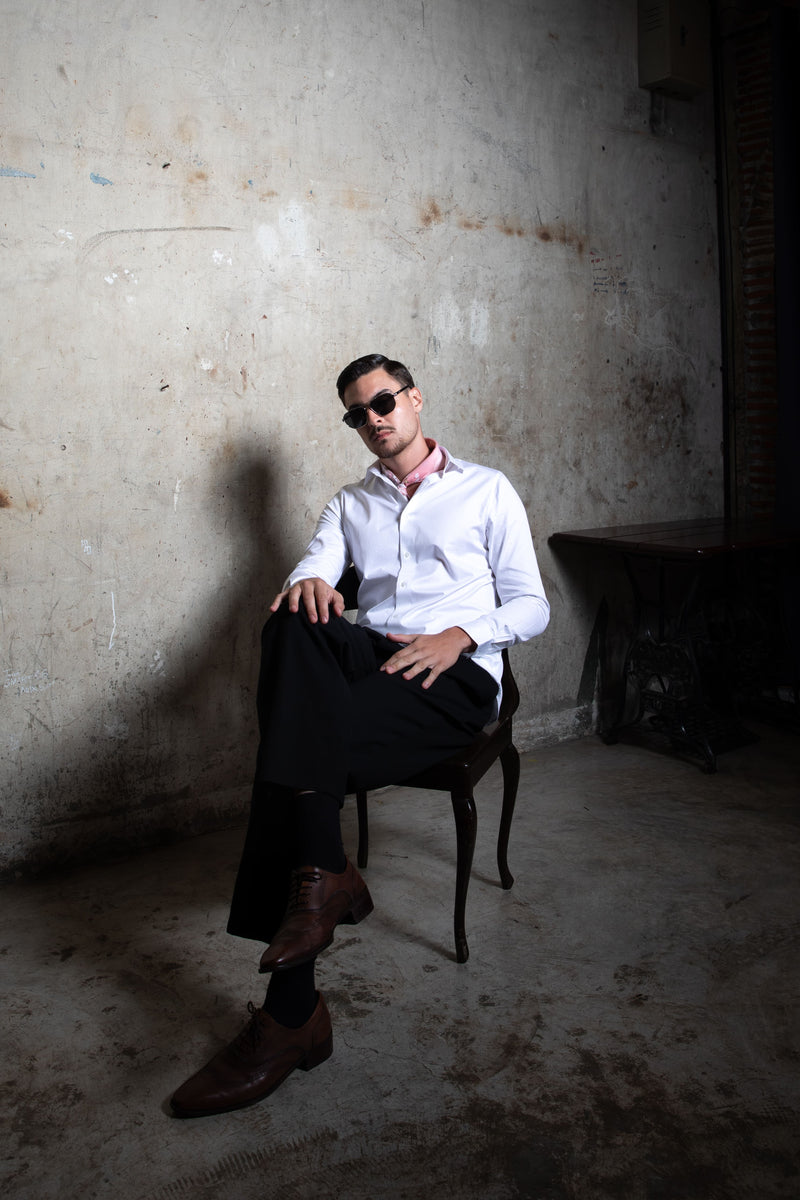 Modern Indian groom wearing elegant tailored wedding shirt with minimal luxury styling by Tarrit