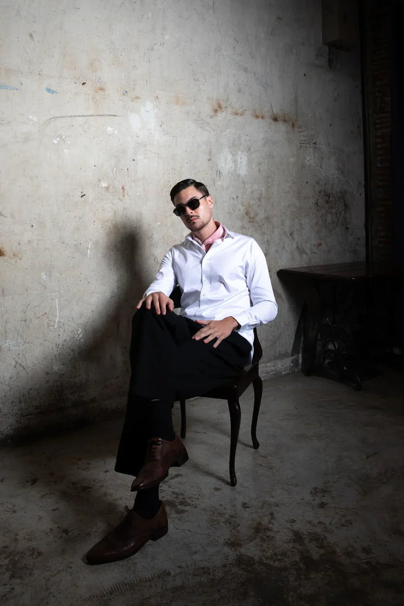 Groom coordinating wedding shirts with groomsmen in India showing structured fit and aligned styling